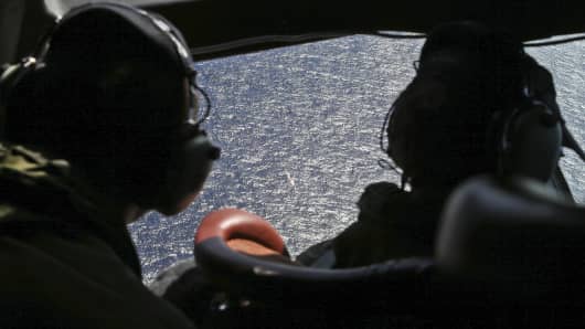 Commanders look out the cockpit windows during search operations for missing Malaysia Airlines Flight MH370 in Southern Indian Ocean, near Australia.